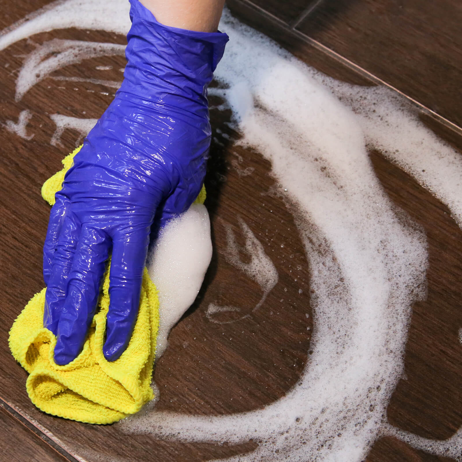 Tile Cleaning with hands | BMG Flooring & Tile Center