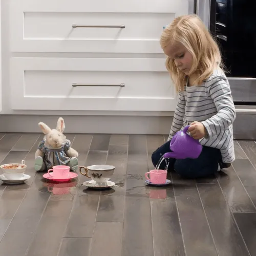Girl playing with toys | BMG Flooring & Tile Center